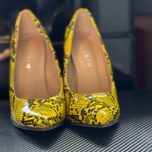 Yellow snakeskin stiletto heels